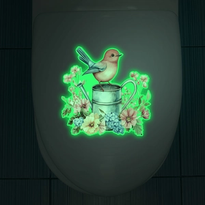 Luminous wall sticker with bird and vintage watering can glowing in the dark