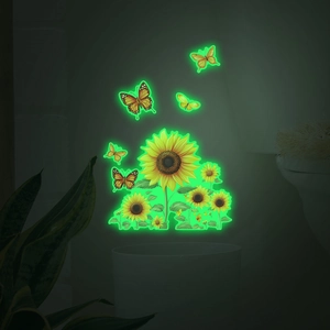 Luminous sunflower and butterfly wall stickers glowing with bright green light in the dark