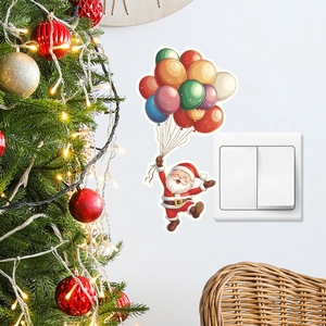 Close-up of Santa Claus wall sticker with colorful balloons next to a decorated Christmas tree