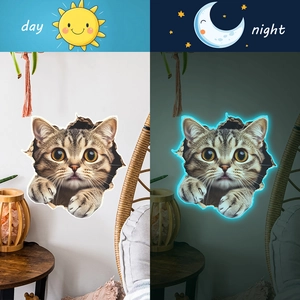 Luminous 3D tabby cat wall sticker showing daylight look and blue glow-in-the-dark night effect