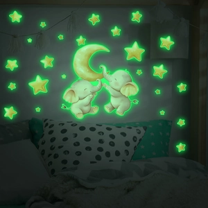 Luminous wall decals with cartoon elephants moon and stars in bright green glow