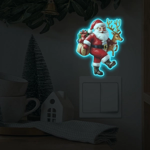 Luminous Christmas Santa and reindeer wall sticker glowing in blue on a light switch