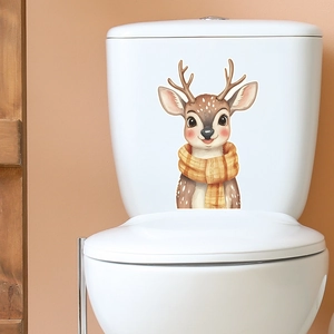 Glow-in-the-dark watercolor reindeer sticker with yellow scarf on a white toilet tank