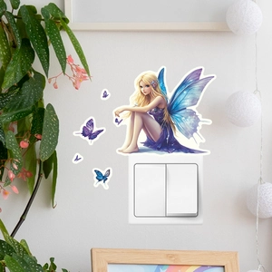 Luminous fairy wall sticker with blue butterflies placed above a light switch