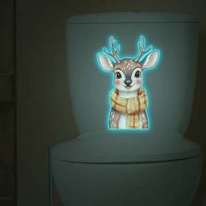 Luminous wall sticker featuring a cartoon deer with a scarf glowing in the dark on a toilet