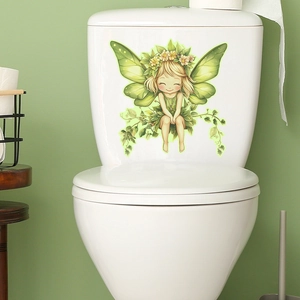 Detailed view of fairy butterfly sticker on a white ceramic toilet with green wall