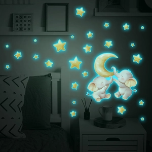 Luminous wall stickers featuring elephants, moon, and stars for kids' bedroom decor