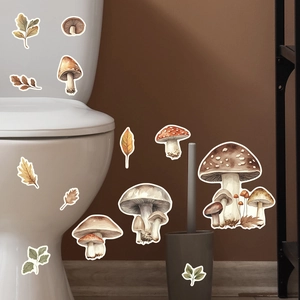 Detailed wall decals featuring mushrooms and autumn leaves applied on a bathroom toilet