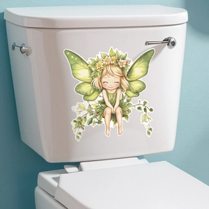 Detailed view of luminous butterfly fairy wall sticker applied on a white toilet tank