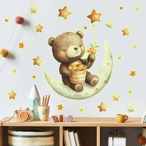 Nursery wall sticker set showing a cute bear on moon with glowing stars above a shelf