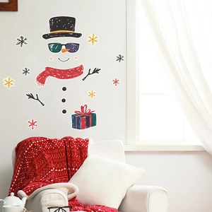 Luminous Christmas snowman wall stickers with sunglasses in a cozy living room scene