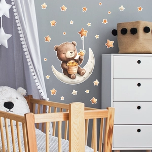 Luminous wall stickers featuring a cute bear on moon with stars in a nursery room setting
