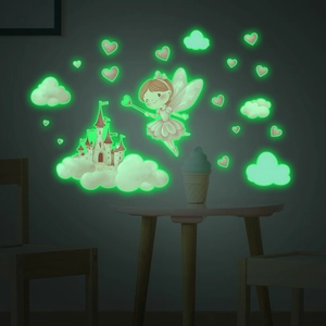 Luminous wall stickers featuring fairy and castle glowing in a dark bedroom