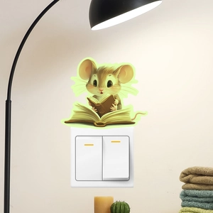 Glow-in-the-dark reading mouse wall sticker placed above a home light switch