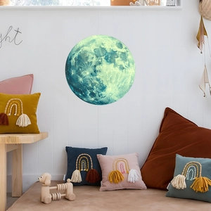 Detailed close-up of a glowing moon wall decal with crater details in a cozy room