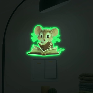 Glow in the dark wall sticker showing a cute mouse reading a book near a light switch