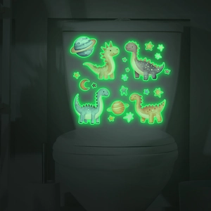 Detailed view of glowing dinosaur wall stickers and stars on a toilet tank in the dark