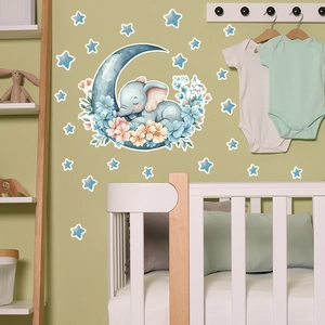 Detailed view of sleeping elephant and moon wall stickers in a cozy nursery bedroom