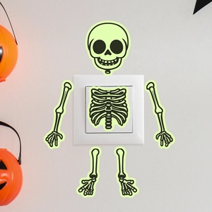 Glow in the dark Halloween skeleton wall sticker around a square light switch