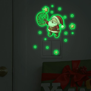 Glow in the dark Christmas Santa catching stars wall sticker set on a dark switch background