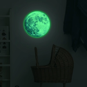 Luminous moon wall sticker with realistic crater texture glowing in dark bedroom