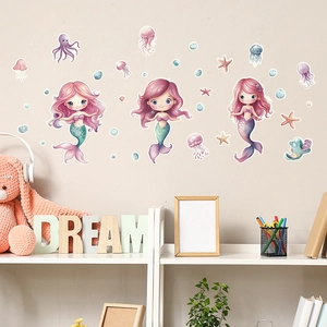 Detail view of cartoon mermaid wall stickers with sea creatures in a kids bedroom