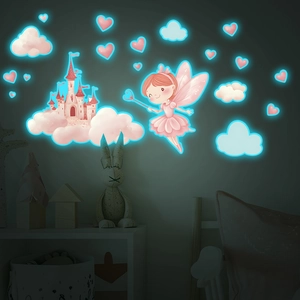 Detailed view of luminous wall stickers showing glowing castle and fairy at night