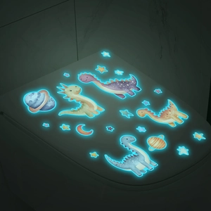 Detailed view of luminous cartoon dinosaur wall stickers glowing in blue in dark rooms