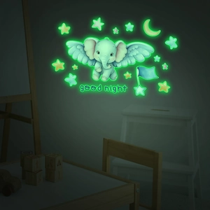 Luminous wall stickers featuring cartoon elephant, moon and stars in a child's bedroom