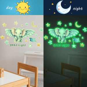 Luminous cartoon elephant and stars wall stickers showing day and night glow effects