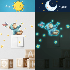 Luminous cartoon bear wall stickers with stars and butterflies showing day and night effects
