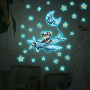 Luminous wall stickers with a cartoon bear flying a plane, moon and blue stars