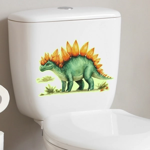 Luminous cartoon stegosaurus sticker applied on white ceramic bathroom toilet tank surface
