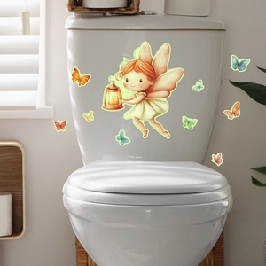 Luminous fairy wall decal with butterfly stickers on a white toilet tank in bathroom