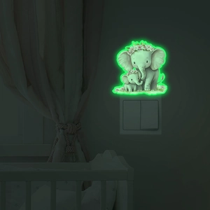Luminous elephant wall sticker for light switches, glowing green in a dark bedroom setting