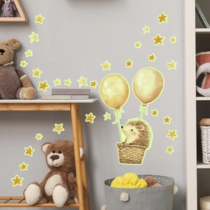 Glow-in-the-dark wall decal with cartoon hedgehog in a hot air balloon and yellow stars