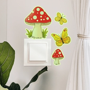 Luminous mushroom and yellow butterfly wall stickers decorating a white light switch