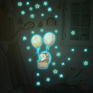 Luminous wall sticker featuring a cartoon hedgehog in a hot air balloon with stars