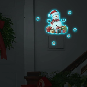 Luminous Christmas snowman wall stickers and colorful gift boxes glowing in the dark room