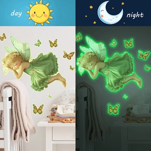 Luminous fairy and butterflies wall stickers showing day and night glowing effect in a nursery