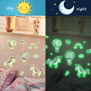 Luminous wall stickers featuring unicorns and hot air balloons for kids room day night view