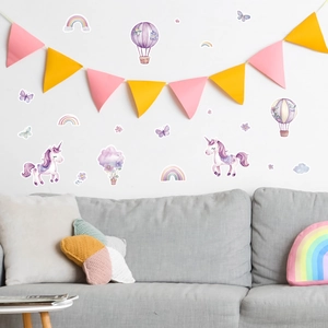 Detailed view of luminous unicorn and rainbow wall decals in a cozy nursery scene