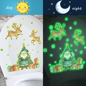 Luminous Christmas decals with gnome, reindeer and tree showing day and night glowing effect