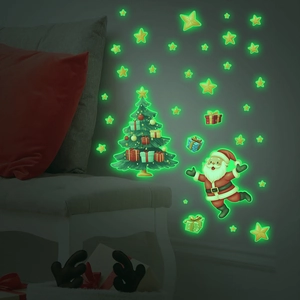 Luminous Christmas wall stickers showing Santa and glowing stars in a dark room scene