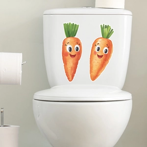 Luminous cute cartoon smiling carrot wall stickers applied on white toilet tank surface
