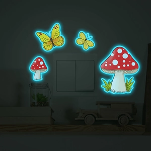 Luminous wall stickers with yellow butterflies and mushrooms glowing around light switch