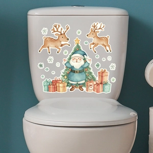 Luminous Christmas toilet stickers featuring Santa, reindeer, and tree on a white tank