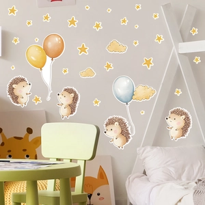 Detailed view of hedgehog wall stickers with stars and balloons in a cozy nursery room