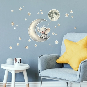Nursery wall sticker with cute elephant sitting on a moon and decorative stars