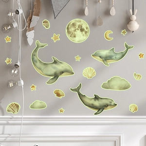 Luminous wall stickers set with green dolphins, moon and stars in children room decor